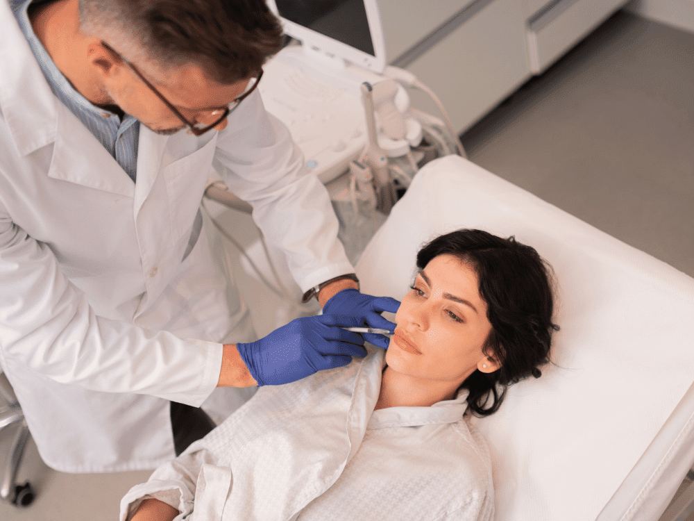 aesthetic nurse performing lip injection on patient